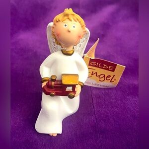 Gilde Angel Figurines and Ornaments. Item no. 28019. Kneeling boy train.